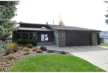 exterior of black home in Leduc